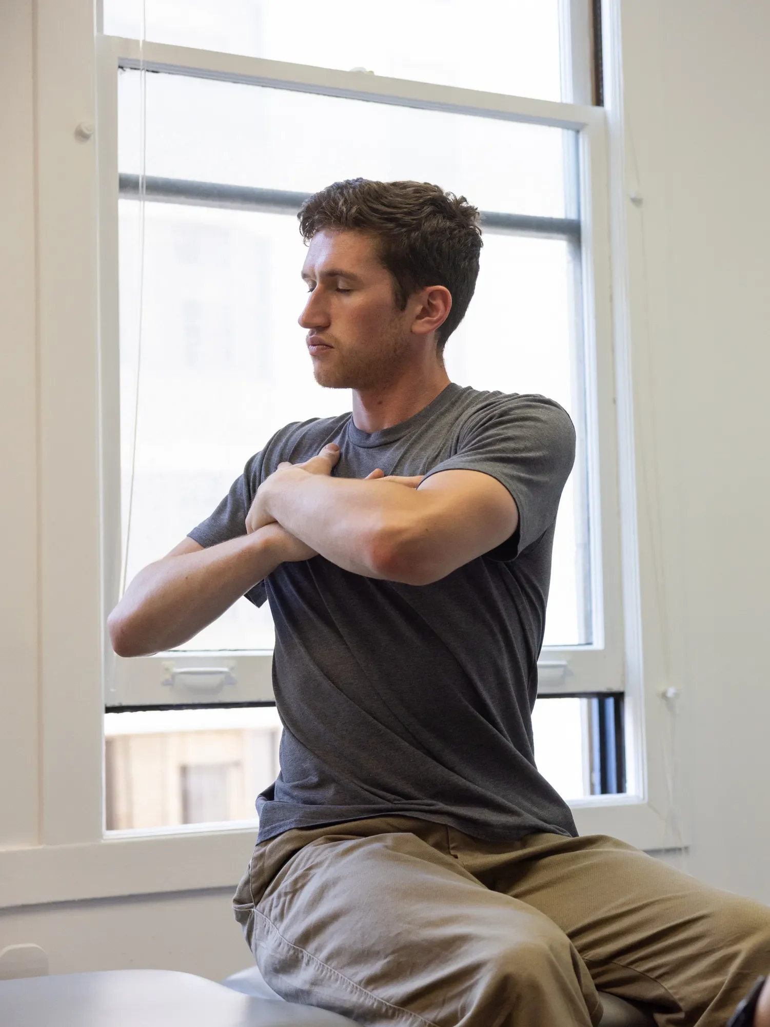 Patient with therapist working with trunk rotations